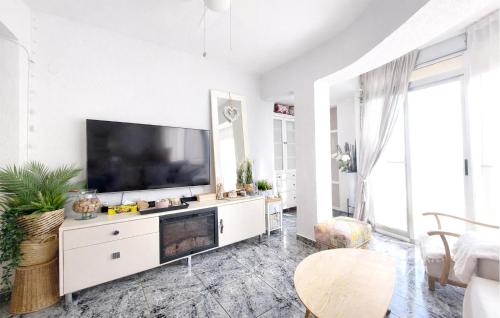 a living room with a large flat screen tv at Marisol Molina in Sueca