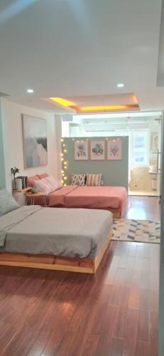 a bedroom with two beds in a room at Khu Hòa Bình in Da Lat