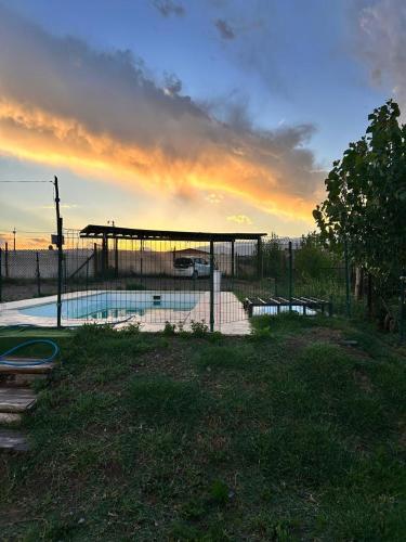 a swimming pool with a pavilion in a yard at el sueño in Las Compuertas