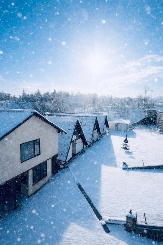a snow covered roof of a house with snow at Willa's Trebisonda in Arsin