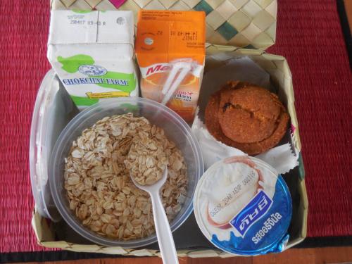 a lunch box with nuts and bread and a spoon at Sala Baï Hotel & Restaurant School in Siem Reap