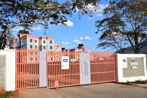 an orange fence with a building behind it at BoniMark in Machakos