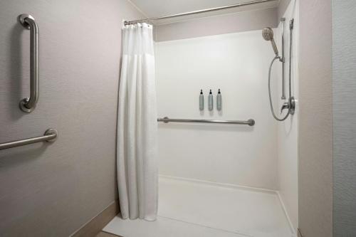 a bathroom with a shower with a shower curtain at Courtyard Hartford Cromwell in Cromwell