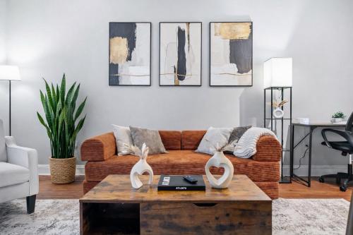 a living room with a couch and a coffee table at Midtown King Bed Suite - Pool - Gym - Parking - Tennis Court in Atlanta