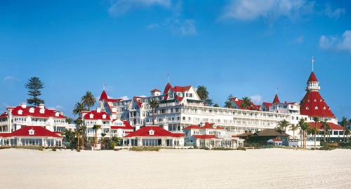 a large building with red roofs on a beach at 2BR Downtown Suite Free Parking - Conv Center in San Diego