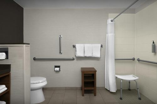 a bathroom with a toilet and a shower at Courtyard Danville in Danville
