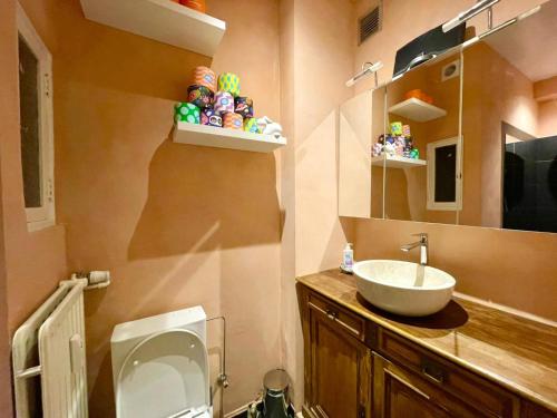 a bathroom with a sink and a toilet and a mirror at Spacious Home in Brussels in Brussels