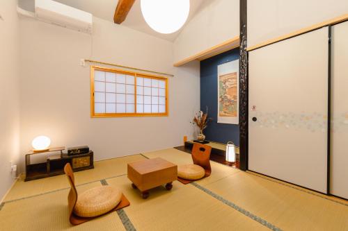 a living room with two chairs and a table at Kyoto Amazing The Wizarad of Oz in Kyoto