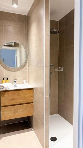 a bathroom with a sink and a shower at Cozy Studio with Pool in Middelkerke 4 Guests in Middelkerke