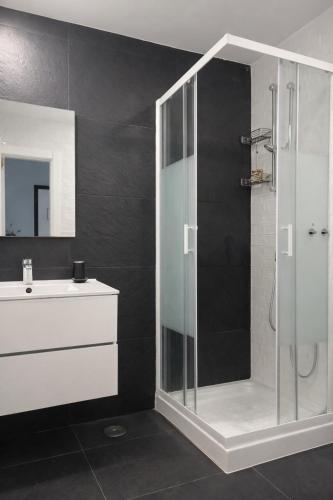 a bathroom with a shower and a sink at Zena Park - Near Lisbon in Odivelas