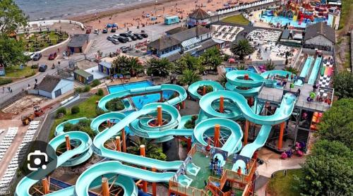 an aerial view of a water park with a water slide at The Nest at Wynncroft in Torquay