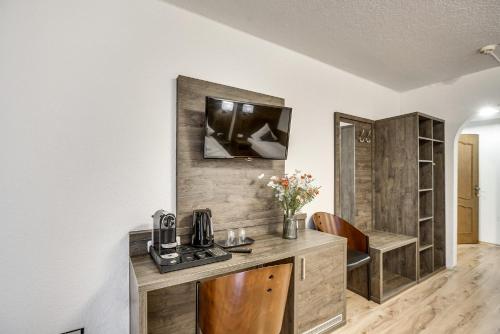 a kitchen with a counter with a coffee maker on it at Hotel Relais Königsberg in Aachen