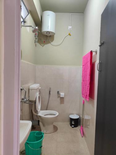 a bathroom with a toilet and a sink at Cloud Haven in Lāitlyngkot