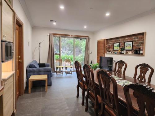 a kitchen and dining room with a table and chairs at Sunset Hues -Enjoy Peace & Nature in Norton Summit