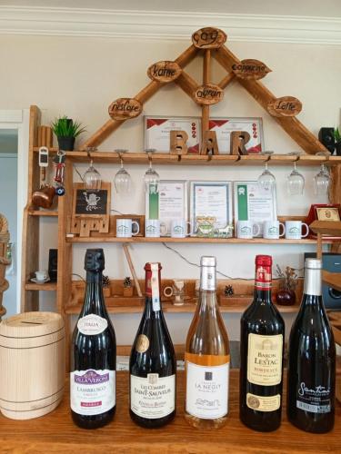 a group of wine bottles sitting on a counter at Balcı Konukevi in Artvin