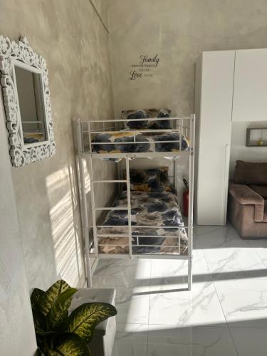 a metal shelf with some cookies in a room at Chez Grenuel in Sanremo