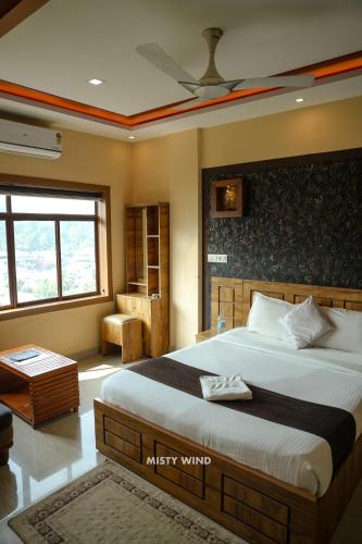 a bedroom with a large bed in a room at Vythiri Misty Wind Holiday Homes in Vythiri