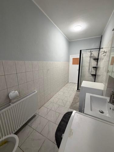 a bathroom with a toilet and a sink at Frisch sanierte Ferienwohnung in Grabow in Grabow