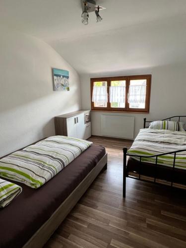 a bedroom with two beds in a room at Albbruck, Feriendomizil Albsteig in Albbruck