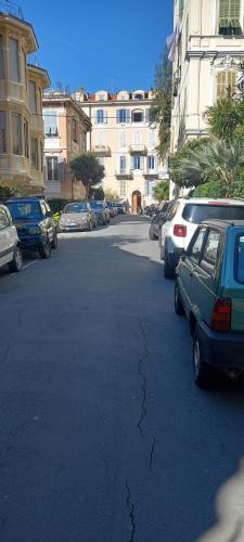 a street with cars parked in a parking lot at Corso Garibaldi mansarda in Sanremo