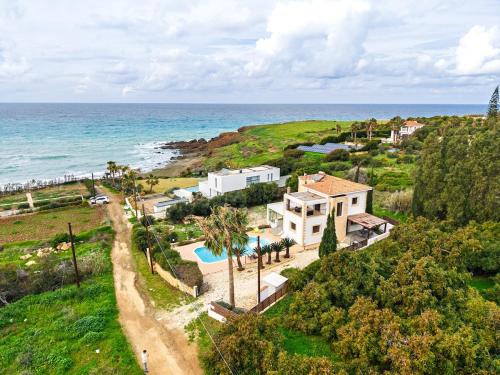 Seafront Villa Agnanti in Nea Dimmata Paphos with private pool and games room