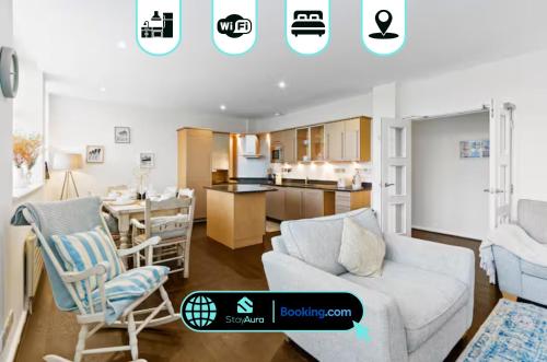 a living room and kitchen with a couch and chairs at Luxury Flat By Stay Aura Contractors Accommodation Brighton With WiFi, Beach & City Centre in Brighton & Hove
