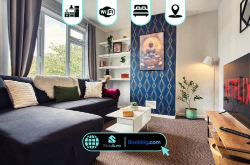 a living room with a couch and a table at Flat By Stay Aura Short Term Lets Newcastle With Free WiFi & Parking in Kenton