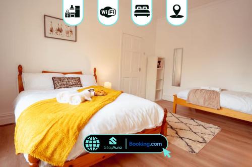 a bedroom with a bed with a stuffed animal on it at Beautiful Flat By Stay Aura Contractors Accommodation Newcastle With Free Parking in Gateshead