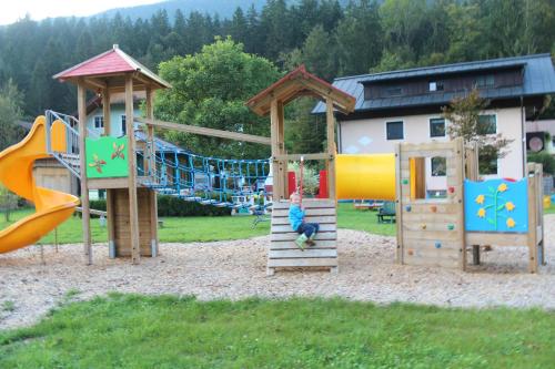 a group of playground equipment in a park at Ferienhof Osl in Obertraun