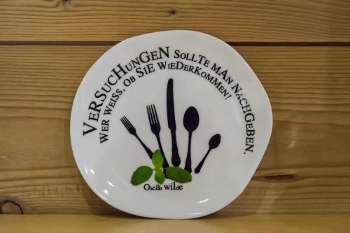 a plate with cutlery on it on a table at Aparthotel Gallahaus in Zell am Ziller