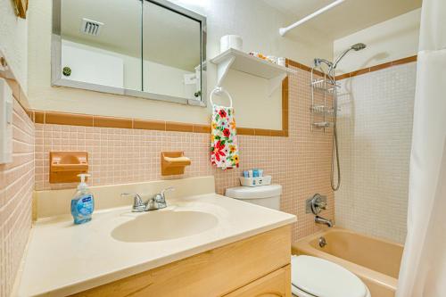 a bathroom with a sink and a toilet at Cute Cocoa Beach Condo w/ Pool & Beach Access! in Cocoa Beach