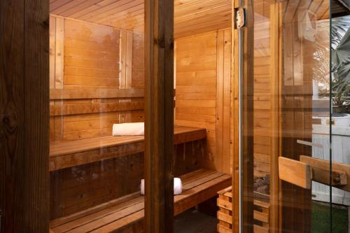 a sauna with wooden walls and wooden shelves at הבית על ההר - Ella Sun in Eilat