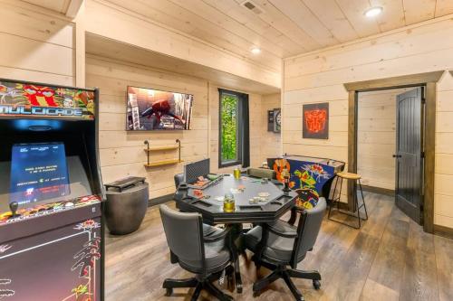 a dining room with a table and chairs at Ridgetop Hideaway in Pigeon Forge