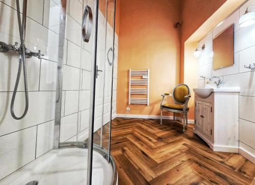 a bathroom with a shower and a sink at Zamek Otmuchów in Otmuchów