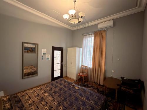 a bedroom with a bed and a window at Bridge House Yerevan Armenia in Yerevan