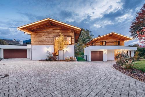 a rendering of a house with a stone driveway at Riverside Chalet Dreitorspitz in Garmisch-Partenkirchen