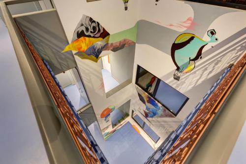 a room with a painting on the wall at Colors Urban Hotel Thessaloniki in Thessaloniki