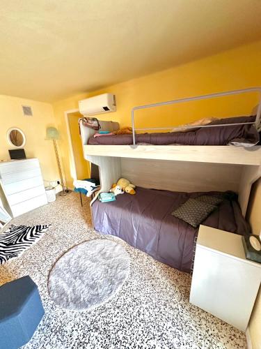 a room with two bunk beds and a rug at Da Ersilia in Cernobbio
