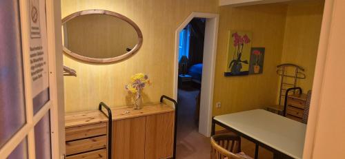 a bathroom with a vanity and a mirror on the wall at Ruhige Ferienwohnung mit Balkon und Terrasse nahe Kassel in Helsa