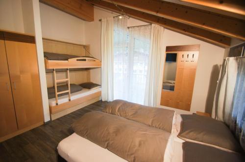 En eller flere senger på et rom på Alpinchalet Eder - Steiner