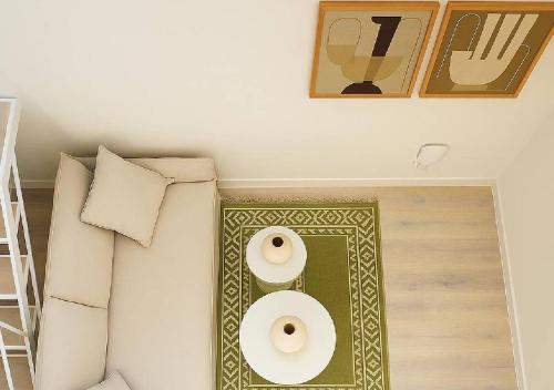 a room with two white towels on a wall at The Village by WPS in Pollonia