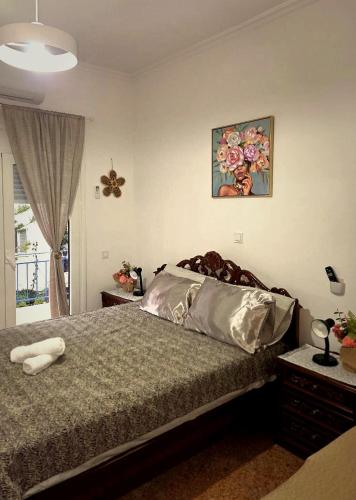 a bedroom with a bed and a picture on the wall at Mytilene Heritage Loft 3A2 in Mytilene