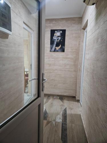 a hallway with a door leading to a room at Rooms Stefan 2 in Subotica