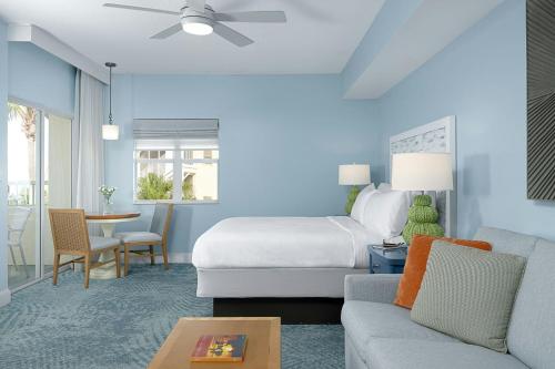 a hotel room with a bed and a couch at Marriott's Harbour Lake in Orlando