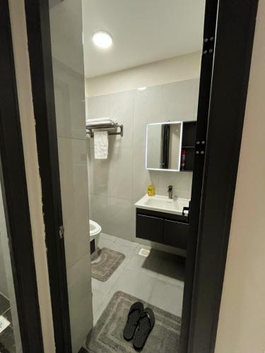 a bathroom with a sink and a toilet at joy in Nairobi