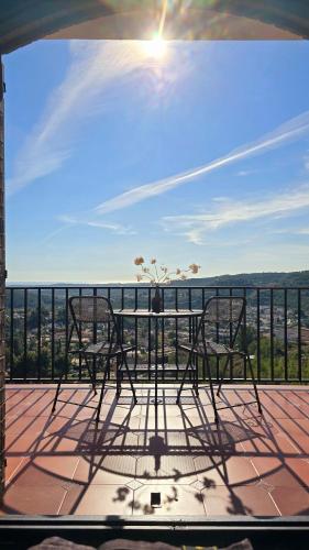 a view of a table and chairs on a balcony at Vida Daurada, sunny oasis with private pool in Vespellá