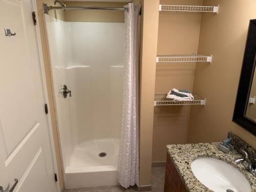 a bathroom with a shower and a sink at Towers at North Myrtle Beach in Myrtle Beach