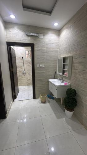 a bathroom with a sink and a shower at شاليهات تولين 2 in Taif