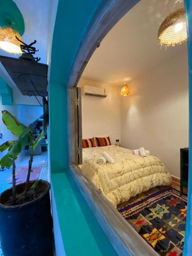a bedroom with a large bed in a room at Hotel & Riad Celia in Marrakesh