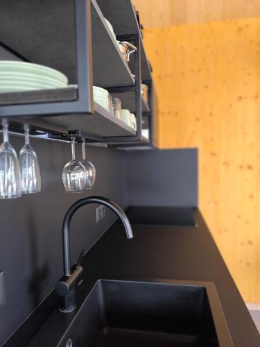a kitchen counter with a sink and a sink at Tiny House 1 im schönen Allgäu mit großem Garten, Naturnah in Bad Wurzach